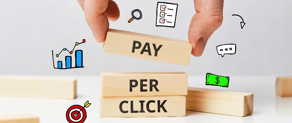 Person stacking blocks that say pay per click.